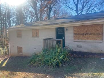 Ranch house with new paint, updated landscaping, and a deck at 2785 Battle Forrest Dr, Decatur, GA 30034