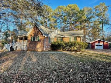 Brick house with a detached garage and yard space at 342 Mccurry Rd, Stockbridge, GA 30281