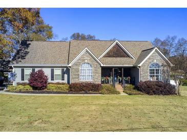 Beautiful one-story home with stone accents and landscaped yard at 201 Abigaile Ct, Mcdonough, GA 30252