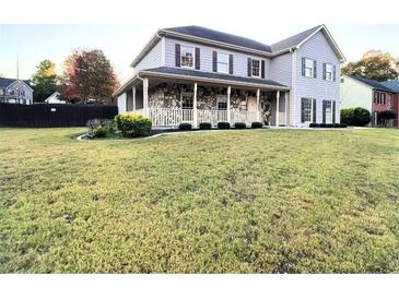 Two-story house with stone accents and a spacious lawn at 2765 Hunters Pond Ln, Snellville, GA 30078