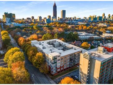 Aerial view of a condo building with city skyline in background at 384 Ralph Mcgill Blvd # 313, Atlanta, GA 30312