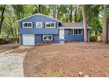 Newly renovated blue house with a spacious yard at 1730 Salina Dr, Jonesboro, GA 30236