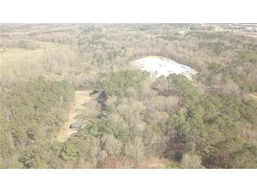 Aerial view showing a house nestled in a wooded area at 295 Hiram Acworth Hwy, Hiram, GA 30141