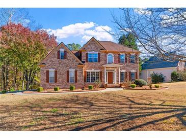 Stately brick two-story home on large lot with lush landscaping at 4125 Crowder Nw Dr, Kennesaw, GA 30152