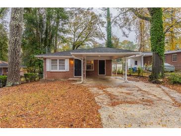 Brick ranch home with carport and mature trees at 1962 Pine Oak Sw Dr, Atlanta, GA 30310