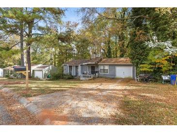 Ranch home with attached garage and large backyard at 1496 Meadowlark Dr, Decatur, GA 30032
