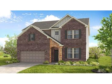 Two-story brick home with a neutral color scheme and a two-car garage at 514 Nolden Trl, Dacula, GA 30019