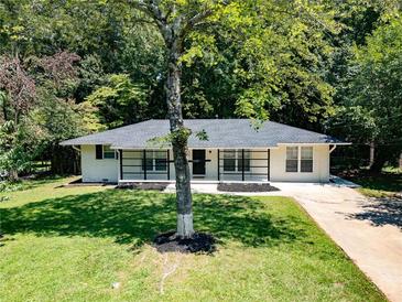 Newly renovated ranch home with modern facade and landscaping at 929 Creekdale Dr, Clarkston, GA 30021