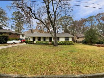 Charming ranch home with a spacious front yard and mature trees at 522 Jo Ann Se Dr, Marietta, GA 30067