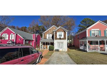 Two-story house with wood siding and a small front yard at 1041 Heritage Valley Rd, Norcross, GA 30093