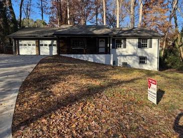 Newly renovated Ranch home with a three-car garage and large backyard at 4498 Ginger Wood Ct, Stone Mountain, GA 30083