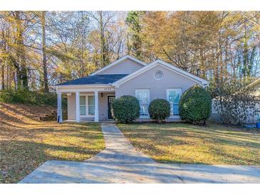 Charming single-story home with a covered front porch and landscaped yard at 2755 Sherlock Dr, Decatur, GA 30034