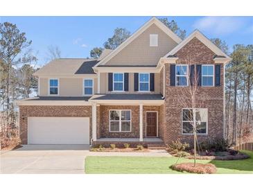 Inviting two-story home with brick and siding exterior, front porch, and attached garage at 6101 Marigold Way, Atlanta, GA 30349