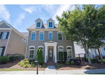 Charming two-story home with a landscaped front yard and inviting entrance at 4835 Abberley Ln, Alpharetta, GA 30022