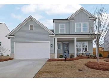 Two-story gray house with white garage door and front porch at 812 Levi Farms Ln, Canton, GA 30115