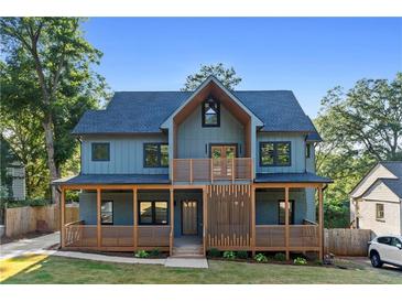 Modern two-story home with blue siding, wood accents, and a covered porch at 561 Ashburton Ave, Decatur, GA 30032