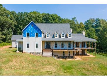 Large two-story home with a wrap-around porch under construction at 772 Old Lathemtown And 776 Rd, Canton, GA 30115