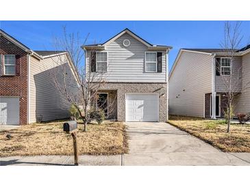 Charming two-story home with a one-car garage and a driveway at 2137 Belmont Cir, Conyers, GA 30012