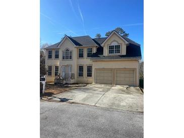 Two-story house with two-car garage and large windows at 1276 Huntington Place Cir, Lithonia, GA 30058