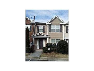 Charming two-story townhome with a welcoming front entrance and neat landscaping at 2800 Vining Ridge Ter, Decatur, GA 30034