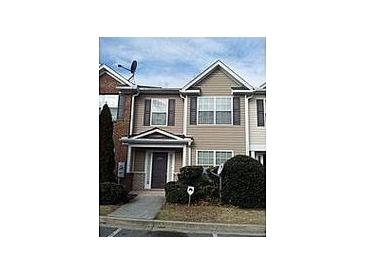 Attractive two-story townhome with a welcoming front entrance and landscaped shrubs at 2920 Vining Ridge Ter, Decatur, GA 30034