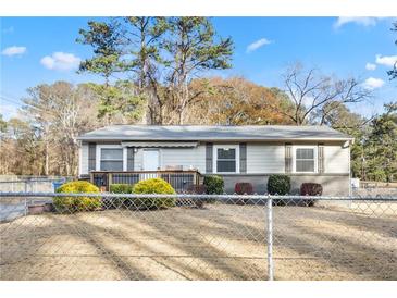 Ranch style home with fenced yard and deck at 1035 Stonewall Se Dr, Atlanta, GA 30315
