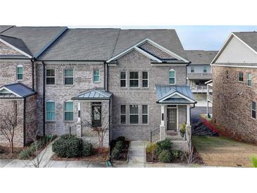 Brick front elevation of townhome with landscaping at 4215 Essex Pond Way, Cumming, GA 30040