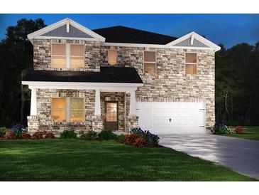 Two-story house with stone accents and a landscaped lawn at 7761 Sheffield Ter, Fairburn, GA 30213