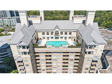 Expansive rooftop pool and lounge area with city views at 3334 Peachtree Ne Rd # 908, Atlanta, GA 30326