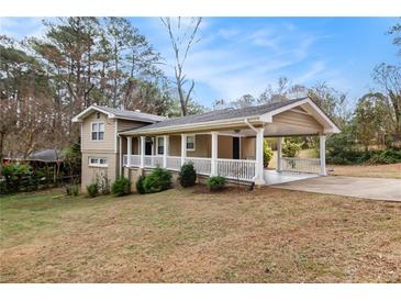 Ranch style home with covered porch and carport at 3435 Misty Valley Rd, Decatur, GA 30032