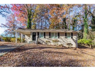Tan brick ranch home with a covered carport and steps leading to the front door at 2329 Meadowlane Sw Dr, Atlanta, GA 30311