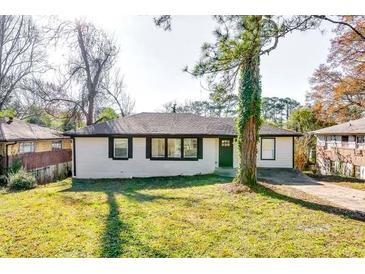 Charming ranch home with a well-manicured lawn and updated exterior at 2835 Laguna Dr, Decatur, GA 30032