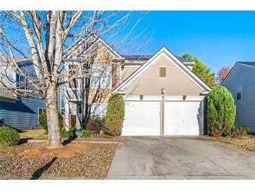 Two-story house with two-car garage and landscaped yard at 3282 Victoria Sw Park, Atlanta, GA 30331