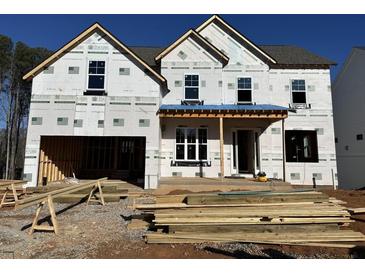 Two-story house under construction, featuring a front porch and large windows at 3340 Hillshire Dr, Cumming, GA 30028