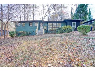 Ranch style home with green brick exterior and landscaping at 1760 Detroit Nw Ave, Atlanta, GA 30314