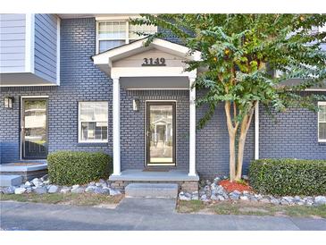 Brick front exterior with covered entryway and landscaping at 3149 Buford Ne Hwy # 7, Atlanta, GA 30329