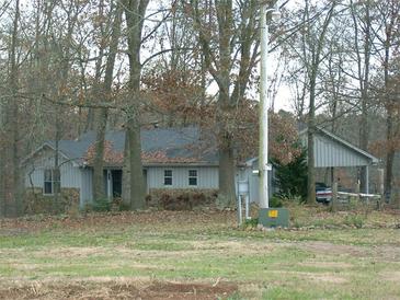 Ranch home nestled among trees, offering a peaceful setting at 4345 Wellington Pl, Cumming, GA 30040