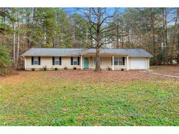 Ranch home with attached garage and well-maintained lawn at 3361 Highway 3 N, Hampton, GA 30228