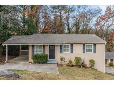 Brick ranch home with carport and landscaped yard at 3597 Fairlane Nw Dr, Atlanta, GA 30331