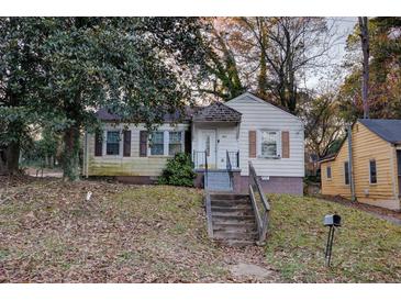 Small house with front steps and yard at 1347 Westmont Sw Rd, Atlanta, GA 30311