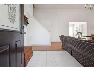 Inviting entryway with tile flooring and staircase at 403 Breanna Ct, Auburn, GA 30011