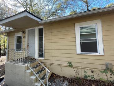 Ranch style home with steps leading to the front door and large windows at 4195 Blanton Sw Ave, Atlanta, GA 30331