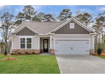 One-story house with gray siding, stone accents and a two-car garage at 416 Newland Way, Acworth, GA 30102