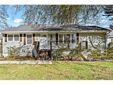 Charming ranch home with modern updates and a landscaped lawn at 517 Woodrow Ave, Atlanta, GA 30354