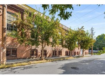 Brick building exterior with trees and street view at 19 Hilliard Se St # 16, Atlanta, GA 30312