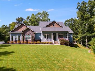 Stunning two-story home with stone accents and a spacious lawn at 5917 N Helton Rd, Villa Rica, GA 30180