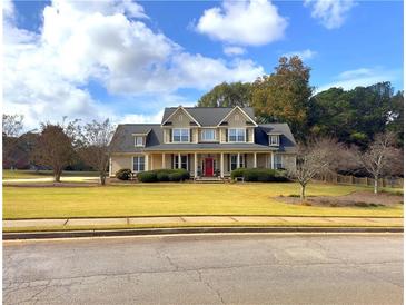 Two-story house with a large front porch and a well-manicured lawn at 200 Suffolk Way, Mcdonough, GA 30252