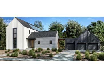 Stunning modern farmhouse with attached two-car garage and solar panels at 150 Cedarwood Ln, Roswell, GA 30075