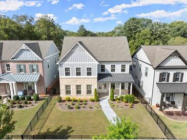 Two-story house with gray siding and a landscaped yard at 3348 Old Concord Se Rd, Smyrna, GA 30082