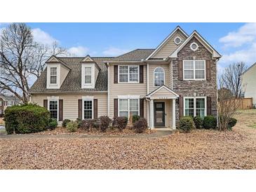 Two-story house with stone accents and landscaping at 5060 Huntcrest Sw Dr, Mableton, GA 30126